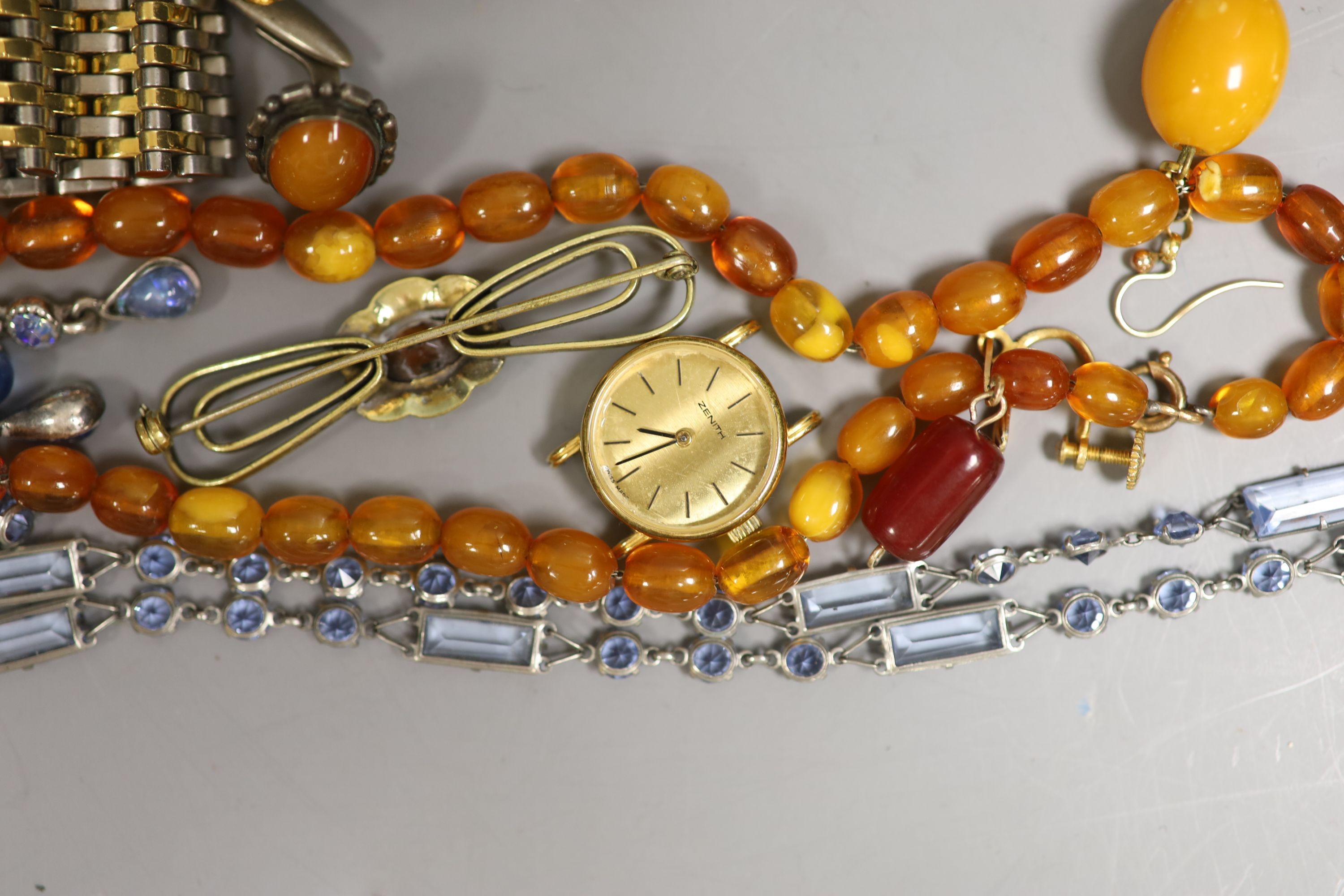 An amber necklace, costume jewellery, watches, etc.